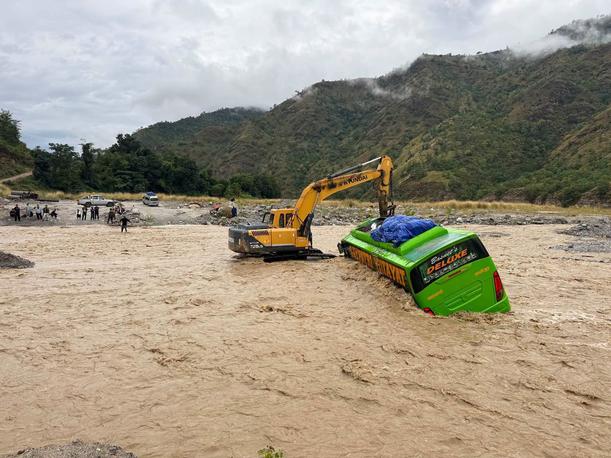 Passenger bus stuck in flood, 30 passengers rescued